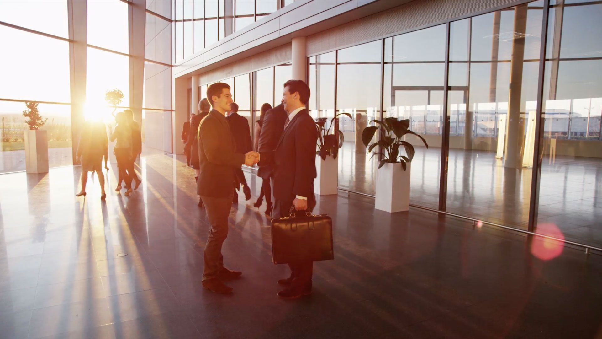 People Shaking Hands in Office Building People Shaking Hands in Office Building